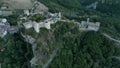 Medieval castle of Roccascalegna laying over green mountains in southern Italy