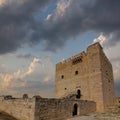 medieval castle tower uplifted on cloudy sky background