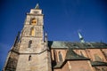 Medieval catholic church of Saint Jilji with gothic High clock tower in sunny autumn day, Nymburk, Central Bohemia, Czech Republic Royalty Free Stock Photo