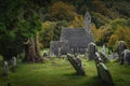 Medieval church, ancient graves, Celtic crosses in Glendalough Cemetery, Ireland Royalty Free Stock Photo