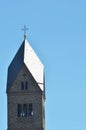 A medieval church bell tower against a clear blue sky Royalty Free Stock Photo