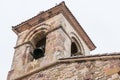 Medieval church bell tower with bells ringing