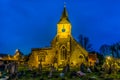 A medieval church highlighted against the night sky in Sanderstead, Croydon, UK Royalty Free Stock Photo