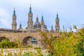 Medieval cityscape with ancient stone bridge over yellow water river Royalty Free Stock Photo