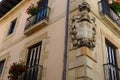 Medieval coat of arms on the corner of classical house, so called