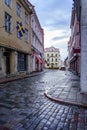 Medieval cobbled street after the rain with reflections in the street. Estonia Royalty Free Stock Photo