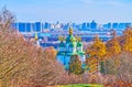 Vydubychi Monastery against the Dnieper River and modern high-rises, Kyiv, Ukraine Royalty Free Stock Photo