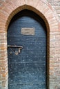 Medieval door with nameplate as template or mock-up.