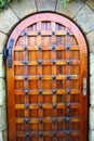 A medieval door under the coast reinforcement wall near Playa De Fanals in Lloret de Mar, Spain.