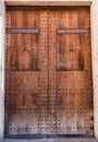 Medieval doors, gates. Spanish traditional ornament on wooden gates. Old wooden gate texture. Strong fortress