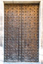 Medieval doors. Spanish traditional ornament on wooden gates. Old wooden gate texture. Strong fortress