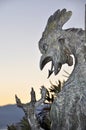 Medieval dragon statue in the castle Gradina, Rijeka city Dragon silhouette closeup in public place.
