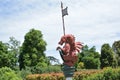 medieval dragon statue with spear, shield and flag