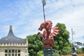 medieval dragon statue with spear, shield and flag