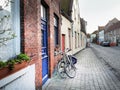 Medieval empty side street of Bruges, Belgium, with a bike parke