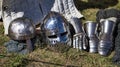Medieval equipment, helmet, metal glove, armor. Medieval spectacle, jugglers and entertainment
