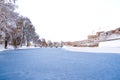 Medieval Fagaras Fortress by the frozen lake in Transylvania, Romania Royalty Free Stock Photo