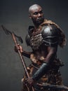 Medieval fighter dressed in protectrive antique clothing holding an axe Royalty Free Stock Photo