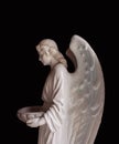 Medieval figure of angel of death. Ancient statue