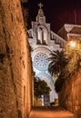 Medieval fortification wall and illuminated church at old town Alcudia, Majorca Spain Royalty Free Stock Photo