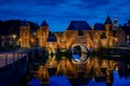 Medieval fortress city wall gate Koppelpoort and Eem River in the city of Amersfoort. Royalty Free Stock Photo