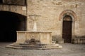 Medieval fountain and San Silvestro Church facade in the main square of the town of Bevagna in Umbria Italy. Royalty Free Stock Photo