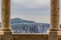 Medieval gazebo stone column symmetry architecture frame on unfocused mountain and cloudy sky background