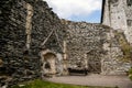 Medieval gothic castle Bezdez, grey stone ruin on hill at sunny day, ancient fortress walls, fairytale stronghold, scalloped walls