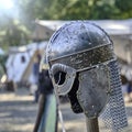 Medieval helmet with circumferential decoration and protective elements for the ears and neck Royalty Free Stock Photo