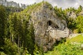 Medieval historic Predjama castle in Slovenia on the side wall of a mountain. Predjama, Slovenia - 20/07/2018