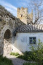 Medieval house, wall and tower of Genoese fortress in the city of Feodosia on the Crimean Peninsula, built by colonists from Genoa Royalty Free Stock Photo