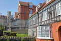 Medieval houses with brickstone and flagstone roofs with Victorian building Purbeck House Hotel in the background, Swanage