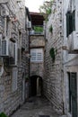 Medieval houses in the narrow streets of Dubrovnik with hanging clothes and stone stairs