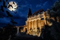 medieval Hunedoara castle in Transylvania, full moon, crows at night - Halloween background Royalty Free Stock Photo