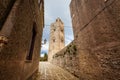 Medieval Italian city with old tower in the middle, path between ancient buildings in the historic center of Erice in Italy