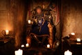 Medieval king on throne in ancient castle interior. Royalty Free Stock Photo