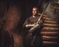 Medieval knight in ancient castle interior.