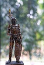 Medieval Knight Gothic Plate Armour with spear and shield on green bokeh background. Royalty Free Stock Photo