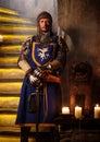 Medieval knight on guard in ancient castle interior. Royalty Free Stock Photo