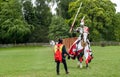 A medieval knight and horse in armour and costume for a joust Royalty Free Stock Photo