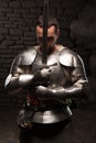 Medieval knight kneeling with sword Royalty Free Stock Photo