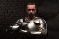 Medieval knight kneeling with sword Royalty Free Stock Photo