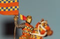 Medieval knight of lead, standard-bearer and bright colors.