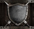 Medieval knight shield and crossed swords on Royalty Free Stock Photo