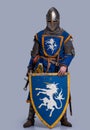 Medieval knight with shield in front of him Royalty Free Stock Photo