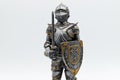 Medieval Knight in silver armour with sword and shield, isolated on white background Royalty Free Stock Photo