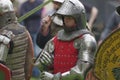 Medieval knight in steel armor, holding hands sword in combat Royalty Free Stock Photo