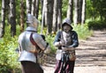 Medieval Knights Fighting with Swords in the Forest Royalty Free Stock Photo