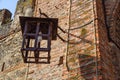 Medieval lantern in the city against a brick wall