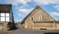 Medieval Limestone Tithe Barn in East Street, Lacock, Wiltshire, UK Royalty Free Stock Photo